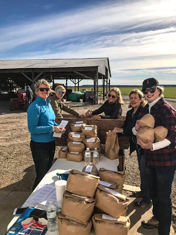 Judy Allen, Valarie Carter, Shannon Smith, Micheal Lockhart and Jan Pearson bagging cornmeal